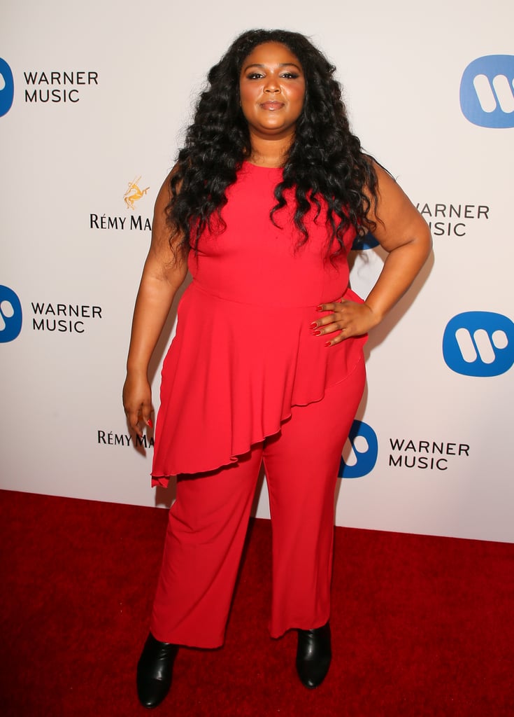 Thought this was a dress? Nope. Lizzo's unique silhouettes and bright colour choices make outfits like this cherry red jumpsuit stand out at every event the singer attends.