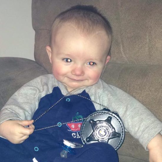 Photo of Baby With Dad's Police Badge