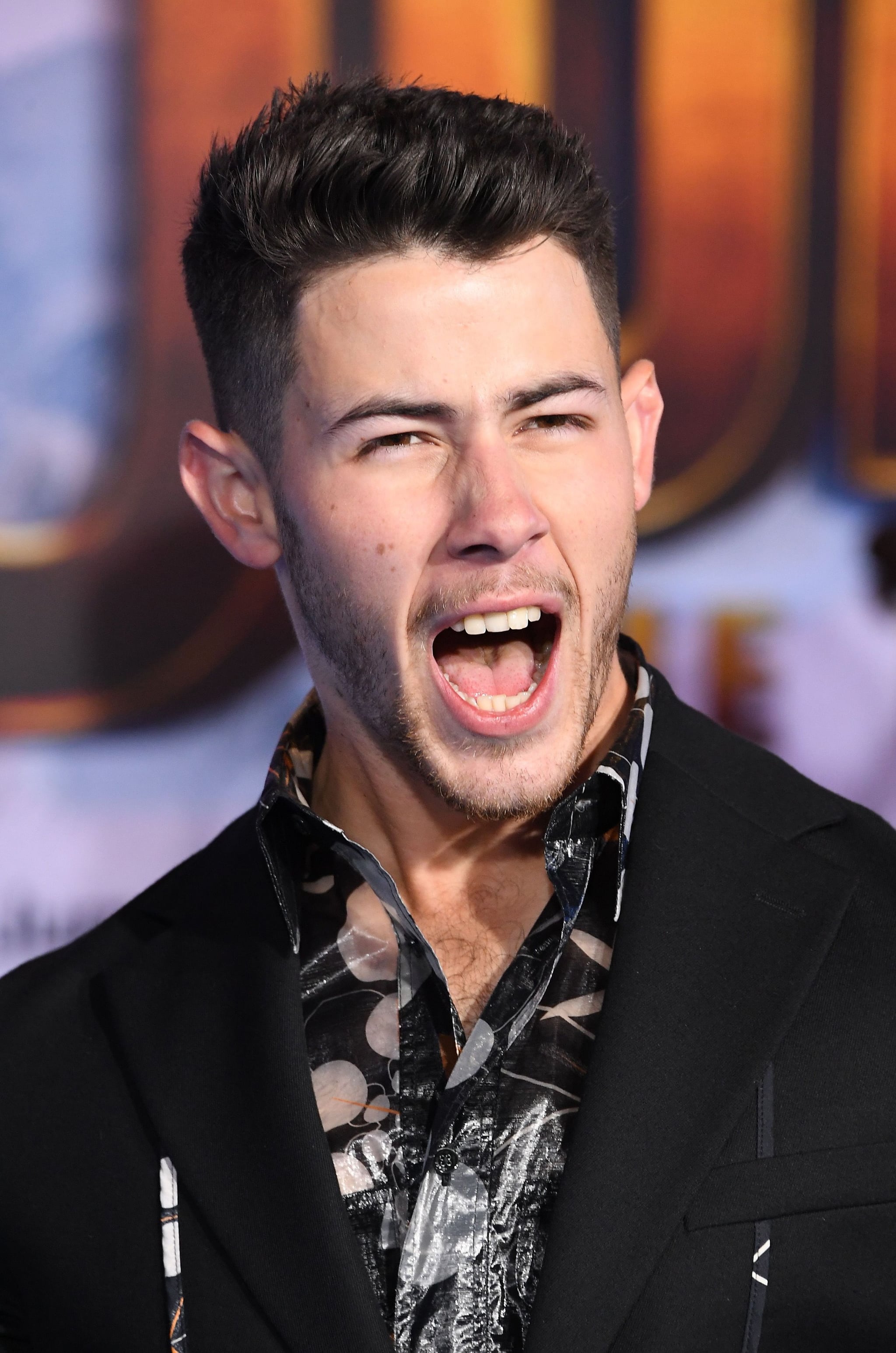Nick Jonas Short Wavy Hairstyle - TheHairStyler.com