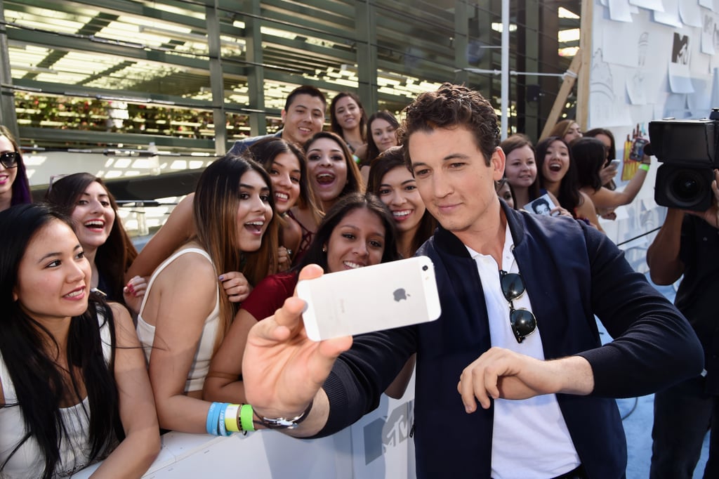 Miles Teller Taking a Selfie