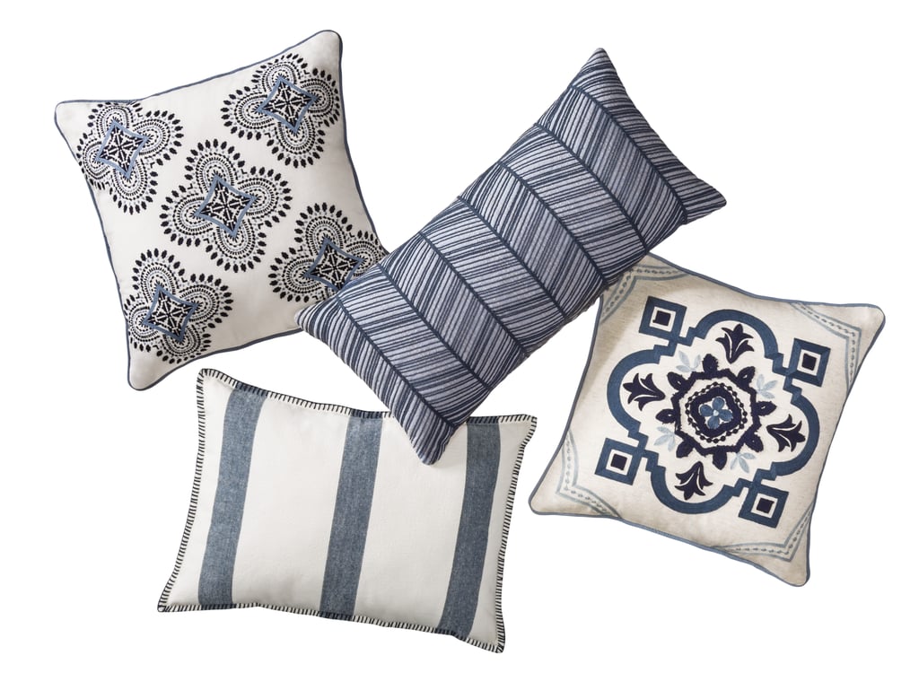 Blue medallion square throw pillow ($20), lumbar pillow ($20), blue icon medallion square throw pillow ($20), blue wide stripe oblong throw pillow ($20)