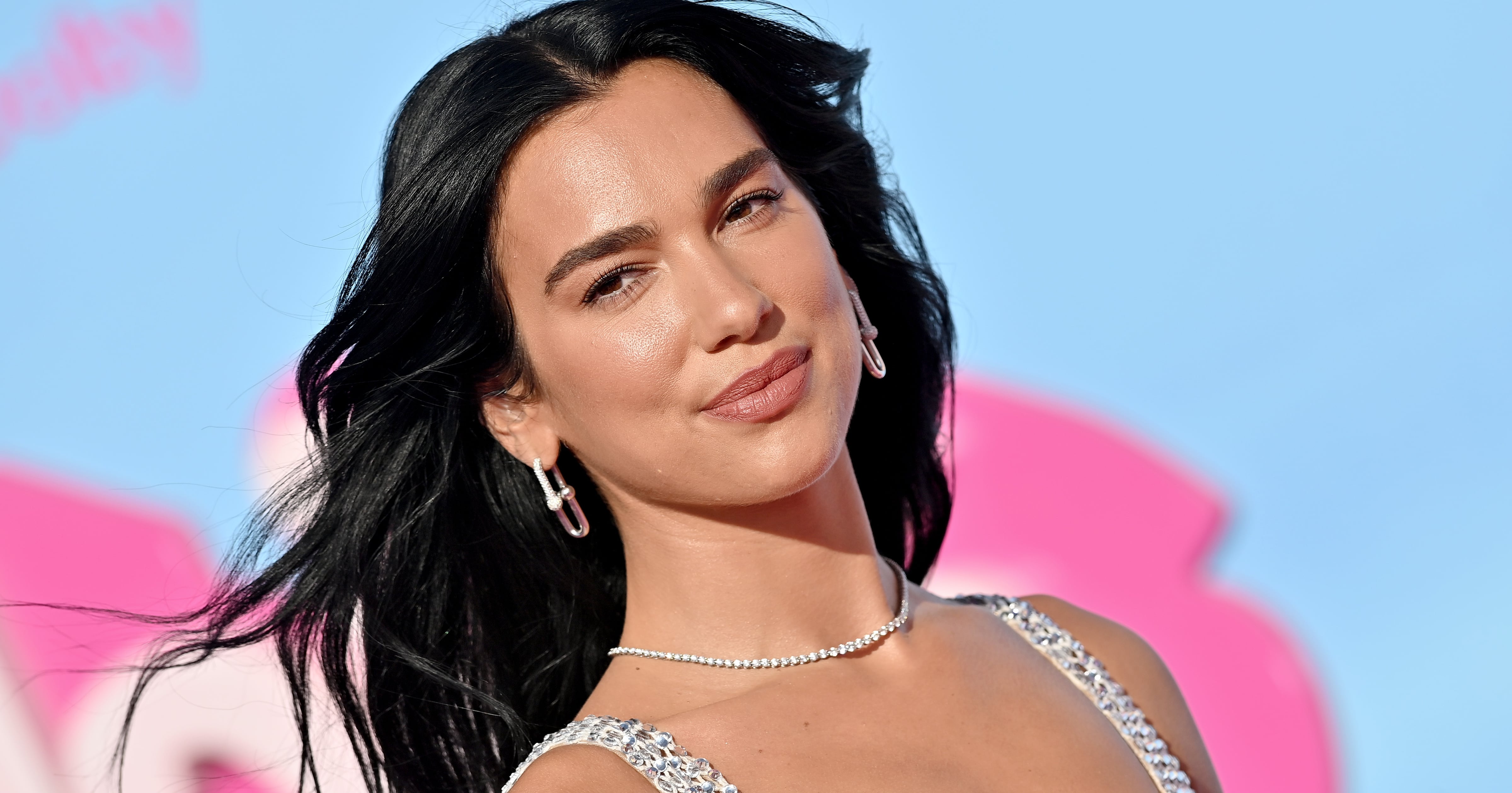 Dua Lipa’s Strappy Metallic Minidress on Vacation