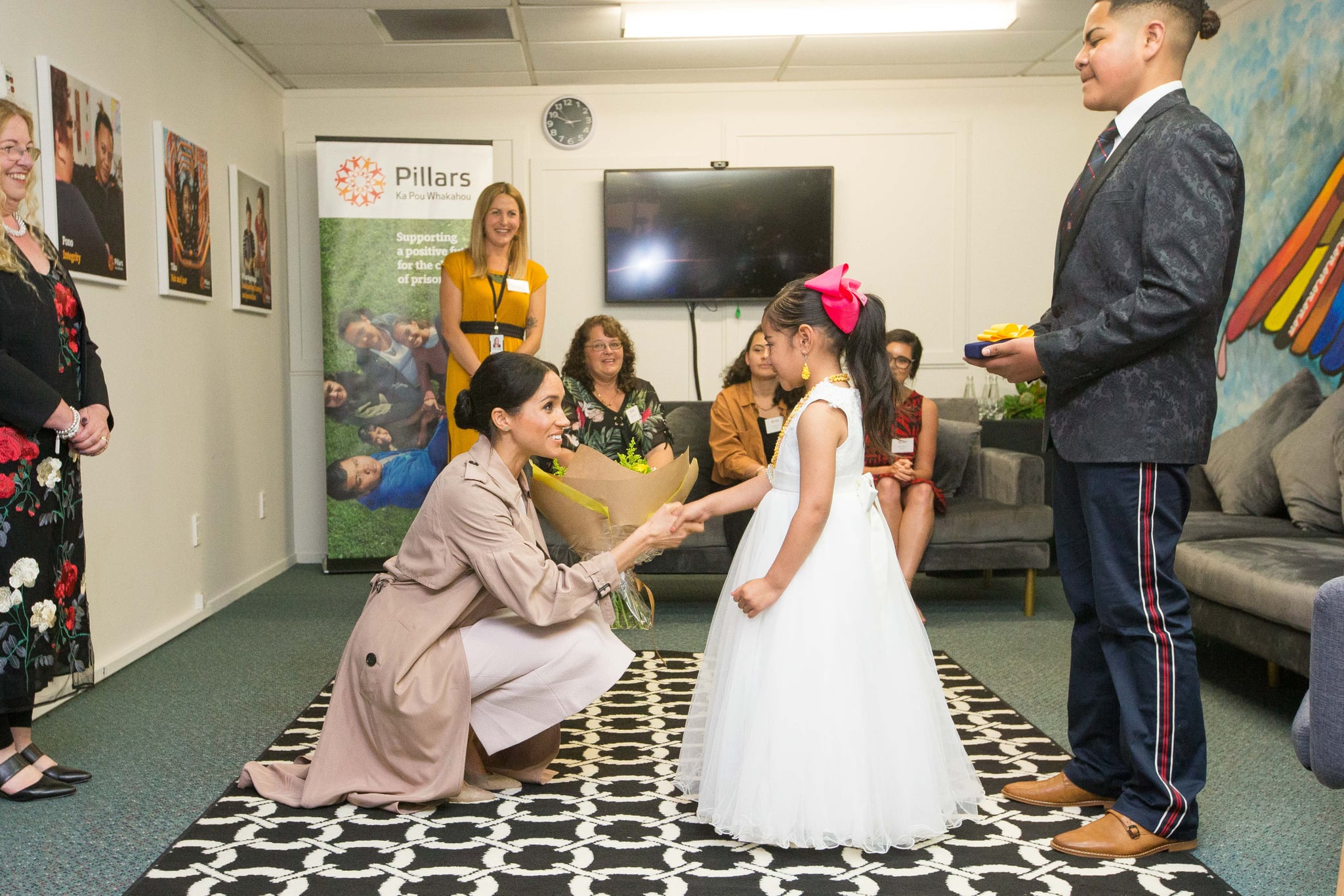 Receiving A Bouquet Of Flowers At Pillars A Charity Operating