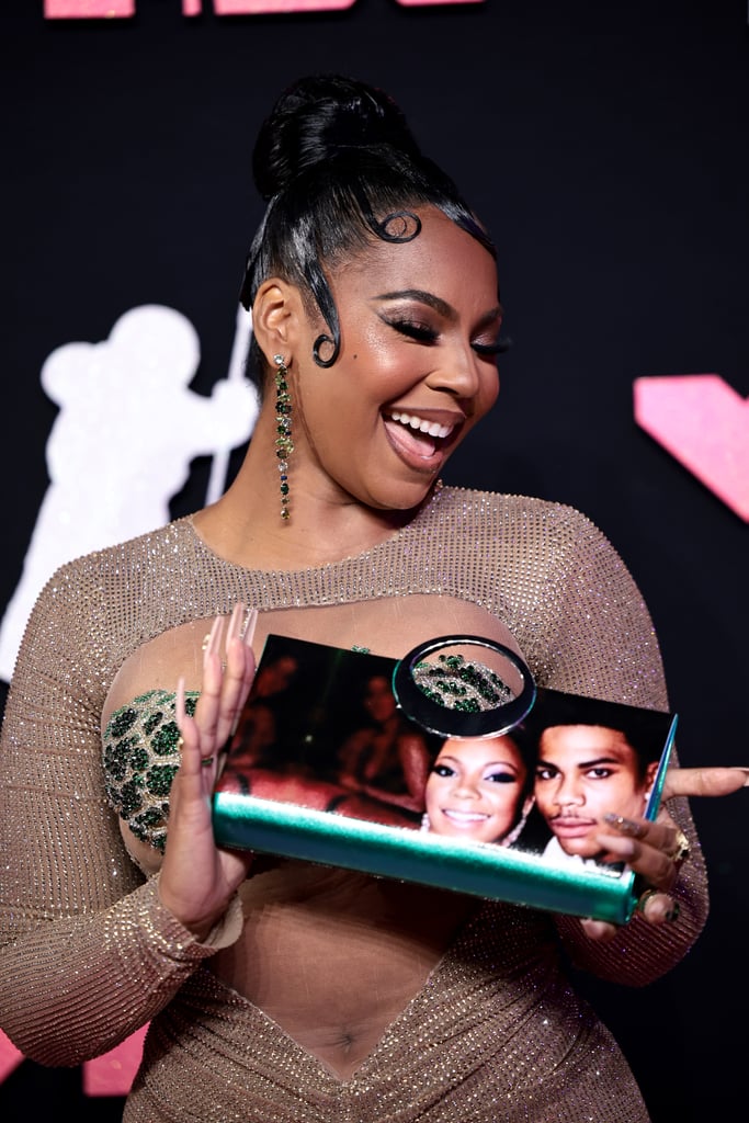 Ashanti's Clutch Features a Photo of Nelly at the VMAs