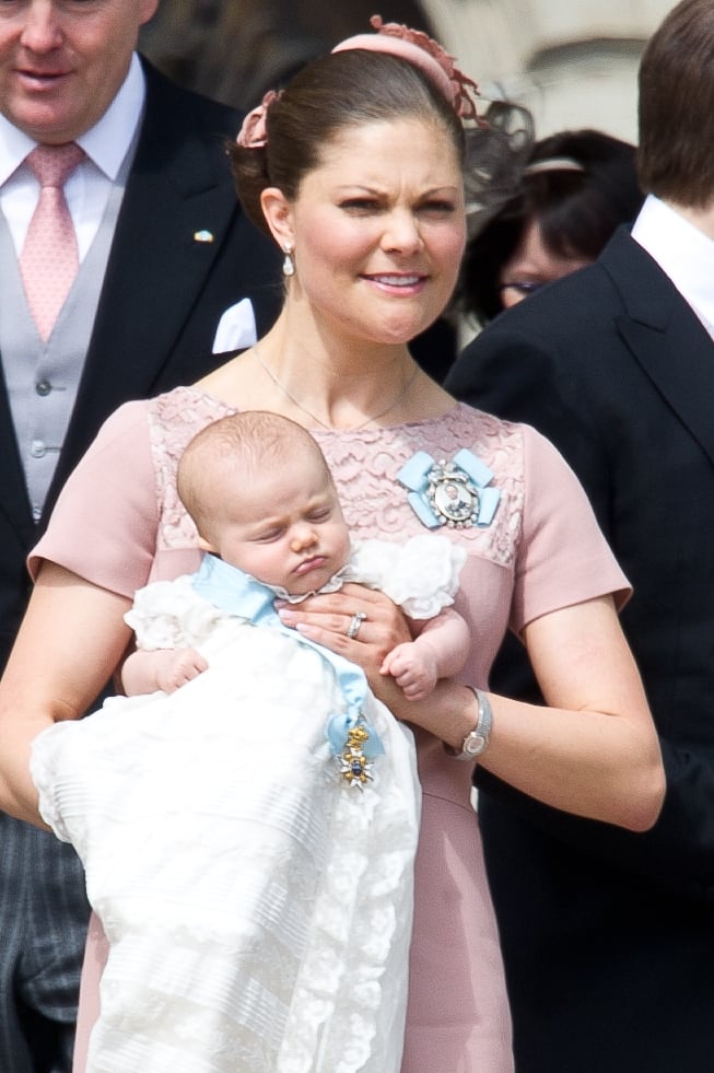 Crown Princess Victoria Holds Princess Estelle at Her Christening