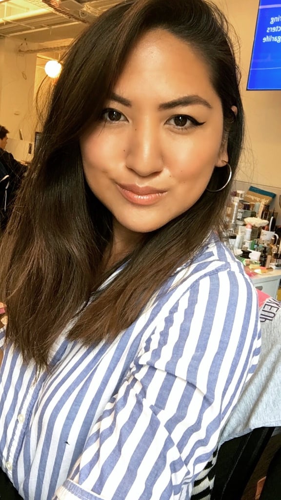 Who: Kristina Rodulfo, editor, Beauty
Complexion: Tan
Review: "First of all, I am obsessed with the vanilla-apricot scent. I hadn't even put it on my lips and I was already in love. Now, for the actual formula: this is not your middle school lip gloss. It feels hydrating, but not sticky (no hairs will stick to your mouth!), and it gives a plumping effect that has me unabashedly duck-facing my way through the day. The slight rose tint is also gorgeous and a perfect match for my own natural lip color."