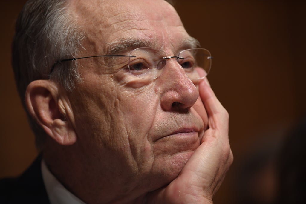 Senate Judiciary Committee Chairman Grassley listens to Ford's testimony.