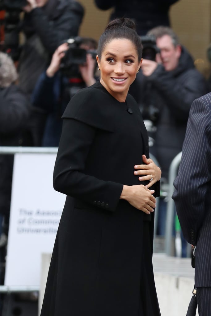 She accessorized with a pair of beige pumps and Dean Davidson gemstone earrings.