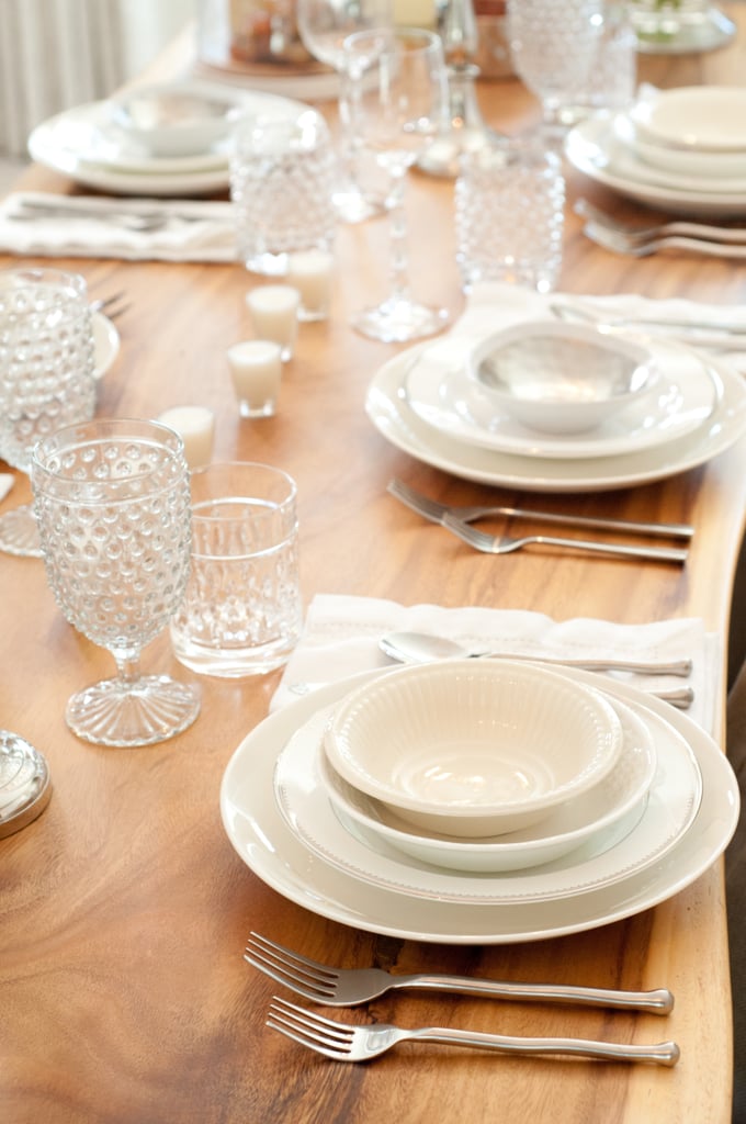 While Lauren keeps the servingware neutral, she makes it interesting by adding textured plates and glassware at varying heights, like these darling hobnail glasses from HomeGoods.