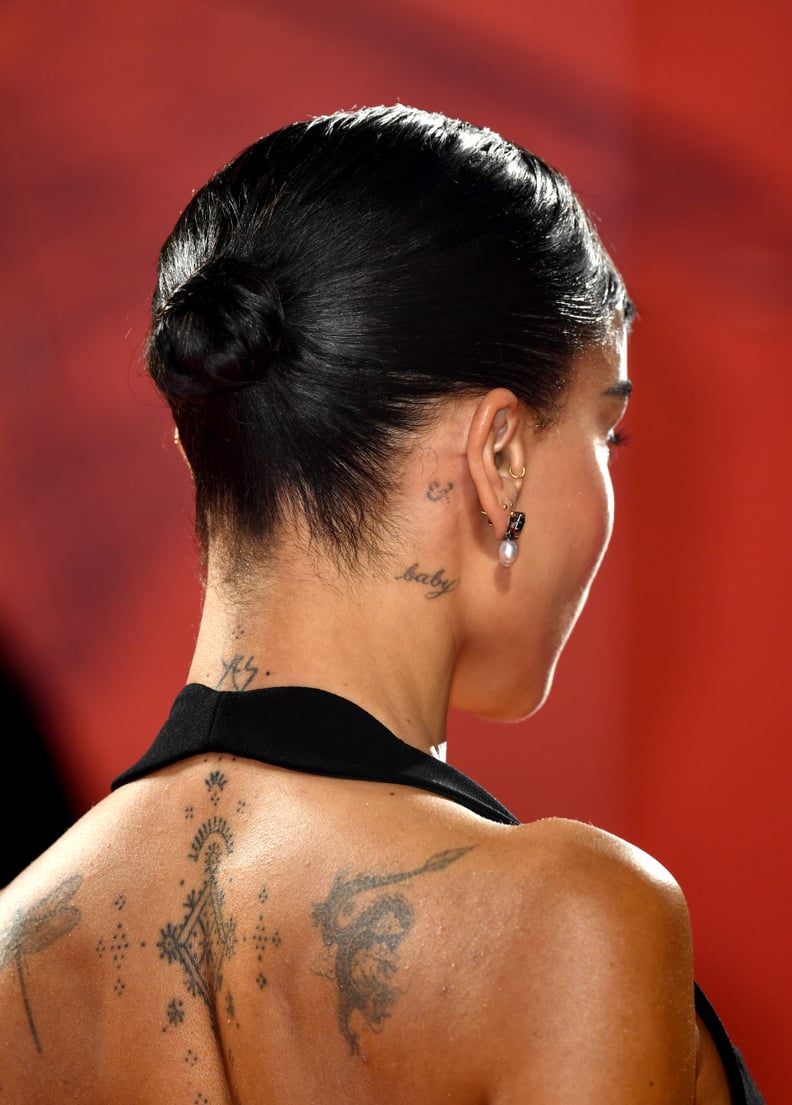 Zoë Kravitz's Tattoos: Dragon and Upper Spine Designs