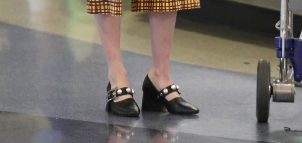 Emma Roberts Black Pearl Pumps in Airport