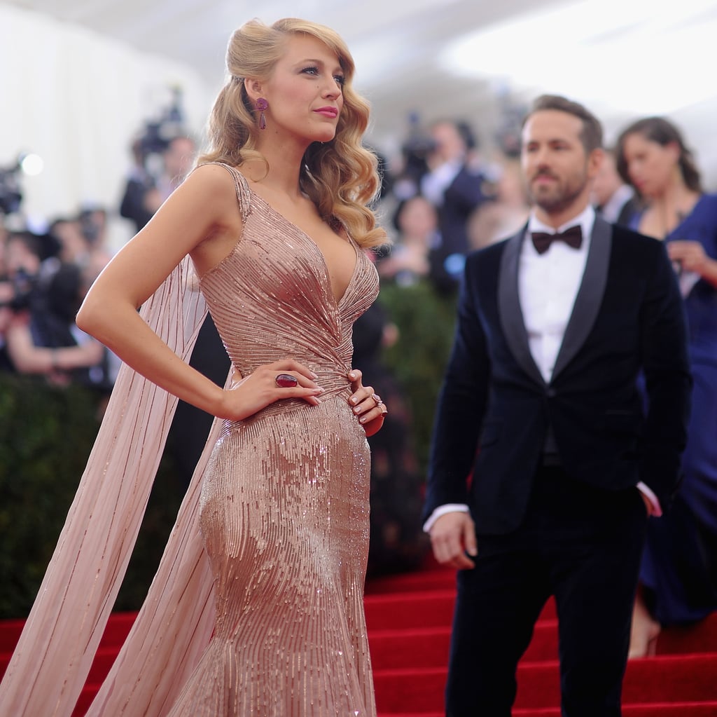Ryan Reynolds patiently waited for his wife, Blake Lively, as the cameras flashed.