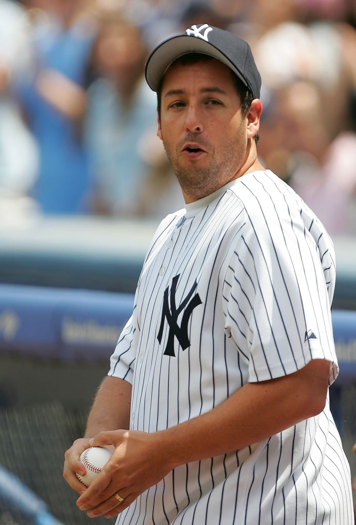 Adam Sandler strapped on his Yankees gear for the first pitch at a game in May 2005.