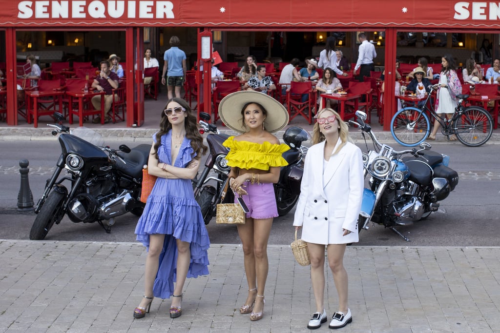 While Emily and Mindy opt for bright holiday attire, Camille pairs loafers and a blazer dress with statement shades and a basket bag for a getaway look that's not quite so obvious.