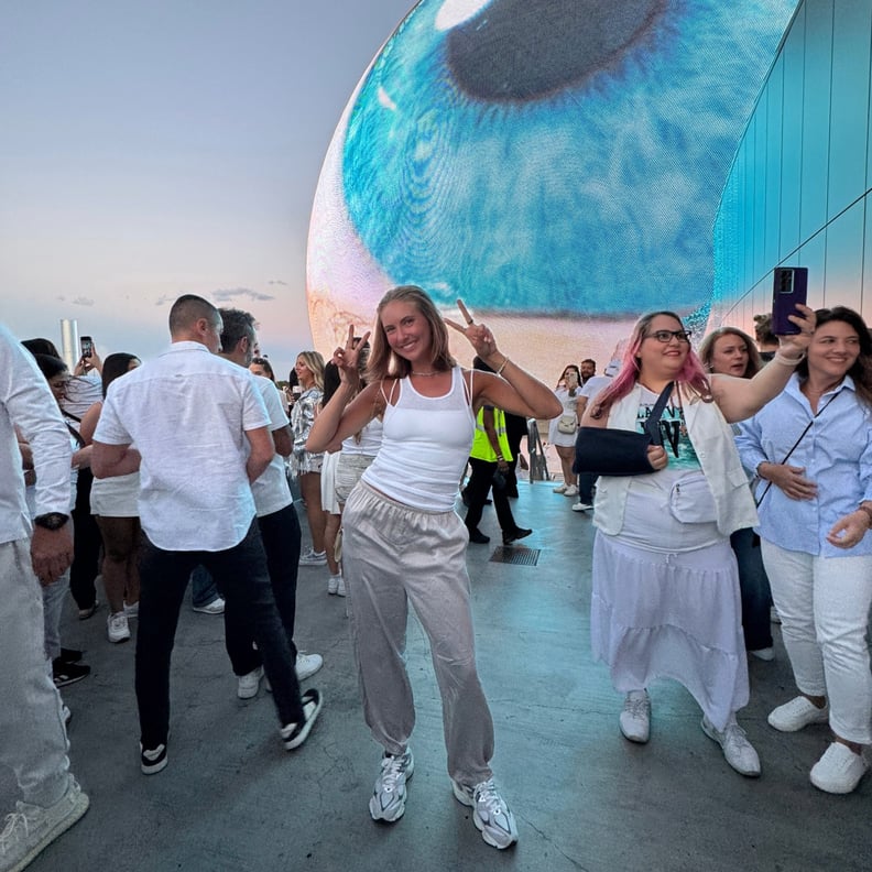 Woman standing in front of The Sphere Las Vegas