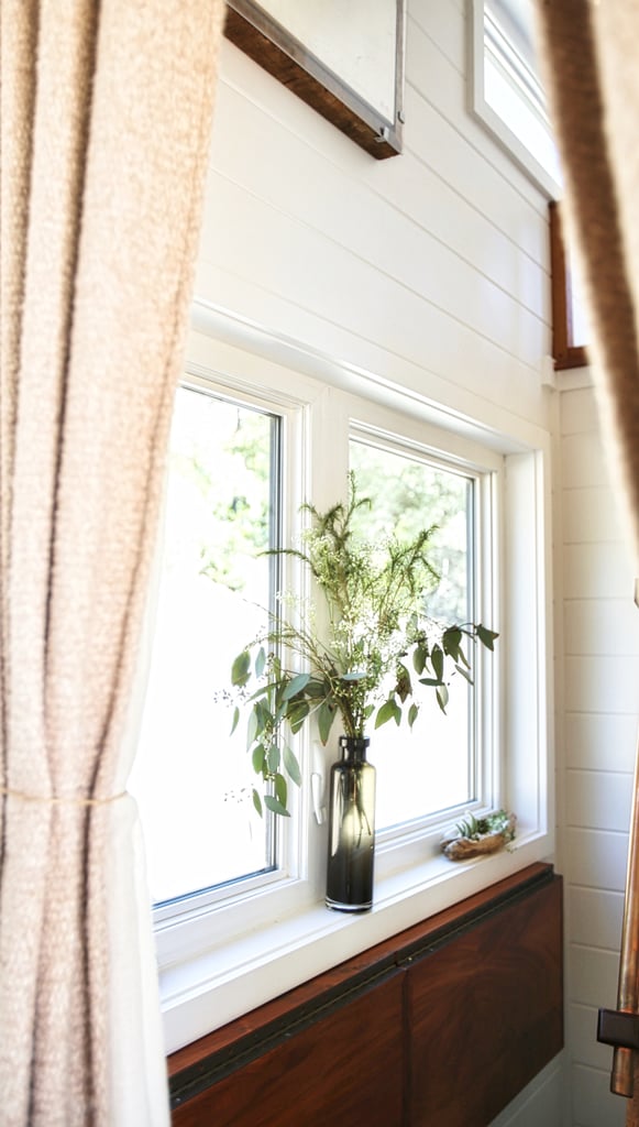 To keep the space bright and lively, Bela brings a little bit of nature inside by adding vases of fresh greenery to her windowsills.