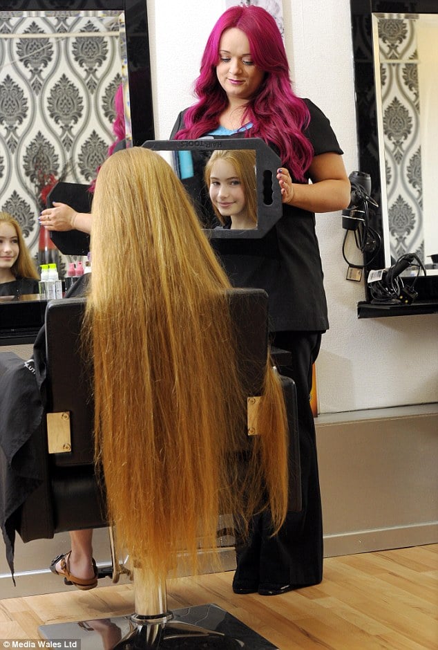 This little real-life Rapunzel loves her hair and can't imagine cutting it.