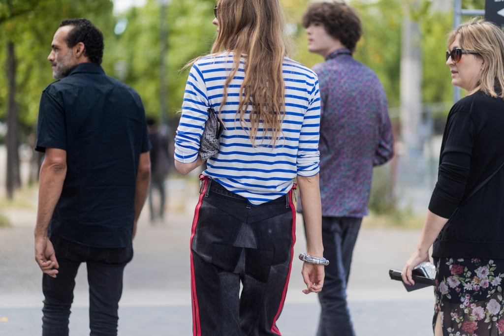 A blue and white stripe pairs seamlessly with red-lined trousers.