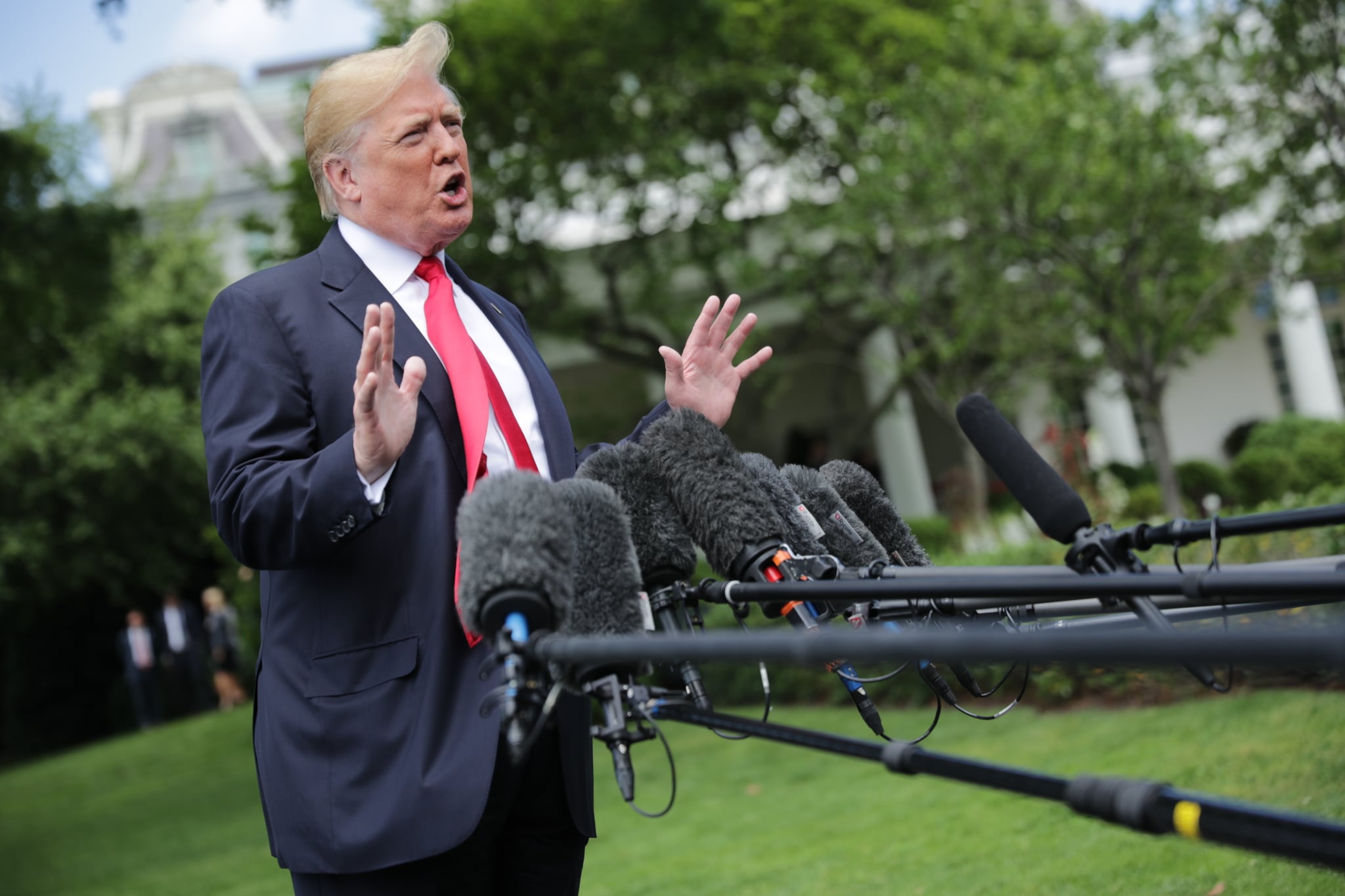 WASHINGTON, DC - MAY 23: U.S. President Donald Trump speaks to the media as he walks across the South Lawn while departing the White House May 23, 2018 in Washington, DC. Trump is traveling to New York where he will tour the Morrelly Homeland Security Center and then attend a roundtable discussion and dinner with supporters before returning to Washington. (Photo by Chip Somodevilla/Getty Images)