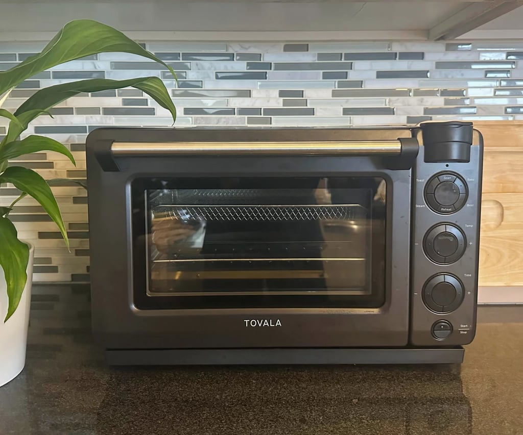 Tovala Smart Oven Pro ($350)
If you love to stock your kitchen with the latest and greatest smart appliances, this one should be on your radar. This versatile six-in-one device allows you to switch between air frying, steaming, baking, broiling, reheating, and toasting. What sets it apart is its smartphone app connectivity, which allows you to heat up specific recipes or frozen foods to perfection. One of our former editors is a big fan. Read her review of the Tovala Smart Oven Pro for more.
Editor Quote: "I'm not one for gimmicky gadgets, and this is far from that. Every single meal was delicious and easy. I think the best thing about this device though is that not only does it work on scanning its own meals, but it also works for popular microwaveable and toaster meals that include everything from Trader Joe's frozen meals to Eggo Waffles." — Krista Jones, former shopping editor