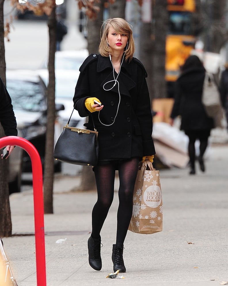 Taylor Swift Styled Black Boots And A Brown Coat In New York