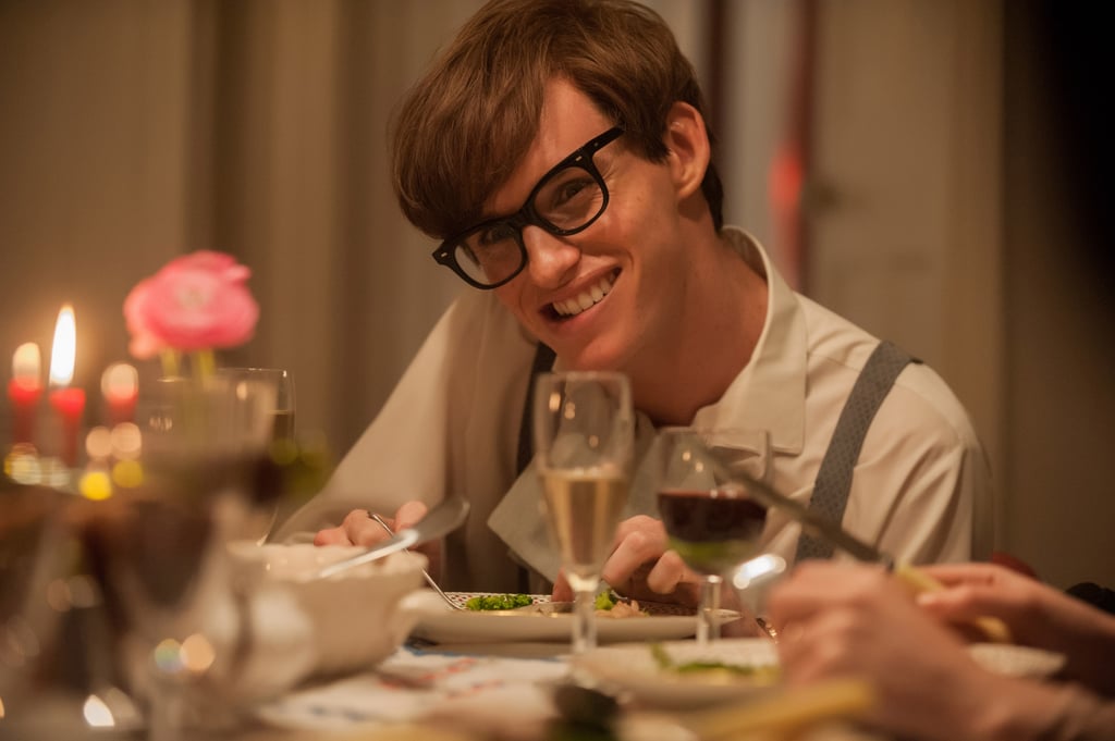 PS: You really perfected Hawking's mannerisms. What was your transformation process, as far as learning to speak like him and walk like him?
ER: Thank you. What's weird about filmmaking is that no one tells you how to do it. I wish they did! Like in theater, you have a director, but in film, until you arrive on set, you are kind of up to your own devices. James [Marsh, the director] was wonderful at helping me go back to this old-school model of having a team. I worked with an amazing makeup designer, costume designer, a voice coach, and a choreographer, a movement coach. [Movement director] Alex Reynolds, who is a dancer, and I went to the motor neuron clinic for four months and met with Dr. Katie Sidel, who was a specialist in MND and ALS. We would meet some of her patients who would allow us to talk to them, and then it was a lot of filming and hearing about their lives. Some of them would allow us to go to their homes. At the same time, we looked at photos of Stephen when he was younger — because there is no documentary footage — and showed them to Dr. Sidel, who would say, "Oh, by the look of that hand, that probably went around this way," and trying to track what the physical decline would be and feeding that back into the script. I found all of the footage I could; I had this iPad full of stuff, and I know it sounds silly, but I would literally sit in front of the mirror with the iPad and try and find these muscles. What's amazing is that Jan [Sewell], the makeup artist, said that by the end of the film, these muscles in the side of my face had grown!