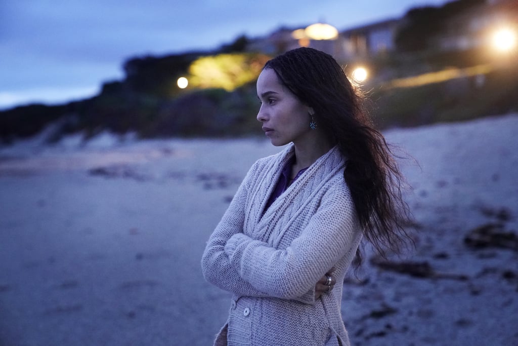 Zoë Kravitz as Bonnie Carlson in a knit cardigan and beaded drop earrings.