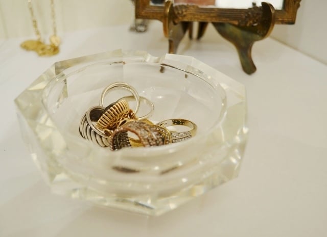 A crystal ash tray on the shelf keeps my everyday jewelry within quick reach.