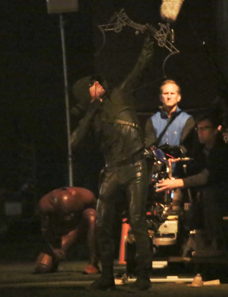 And there's the Flash ducking as Arrow shoots.