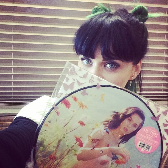 Katy Perry snapped a pic with a copy of her vinyl record on Saturday and, in the process, showed off her green-and-black hair. 
Source: Instagram user katyperry