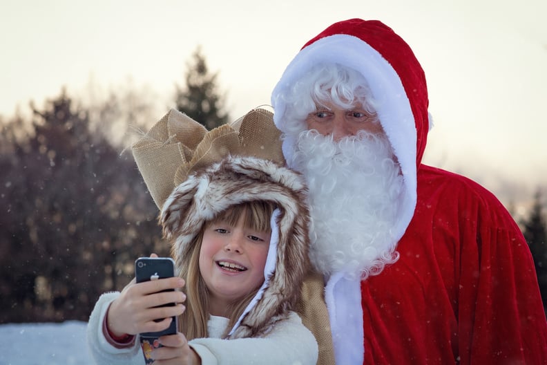 Hunt down the man in the red-and-white suit and snap a pic.