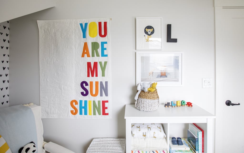 Thoughtful art, cozy accents, and pops of vibrant color set the tone in Leo's darling nursery.