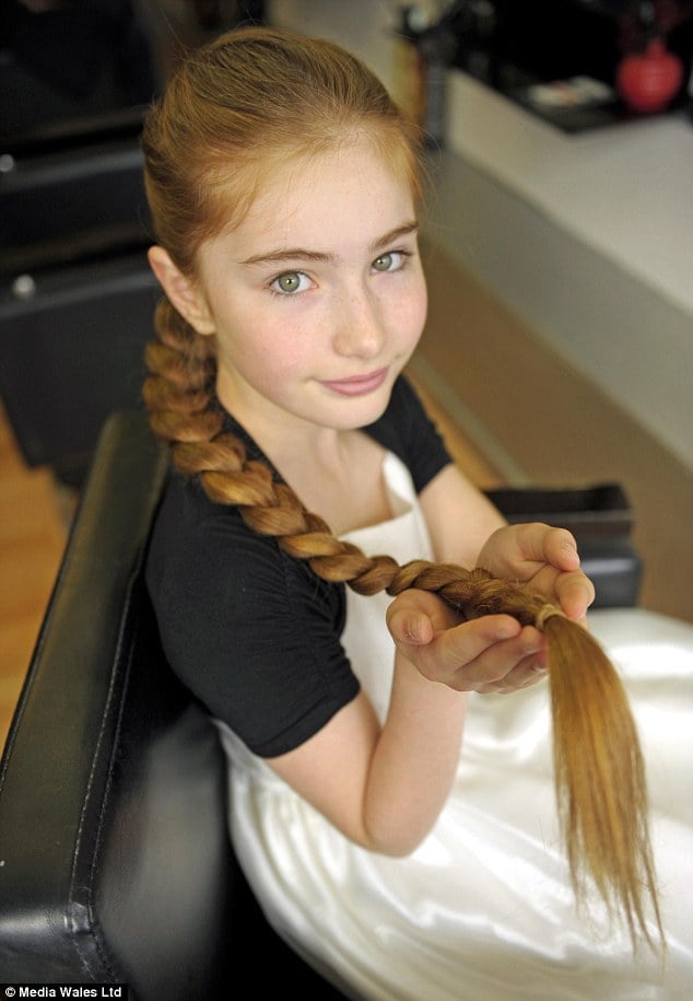 Katy keeps her hair in a braid when practicing Choi Kwang Do, but the long plait sometimes acts like a whip when she turns around.