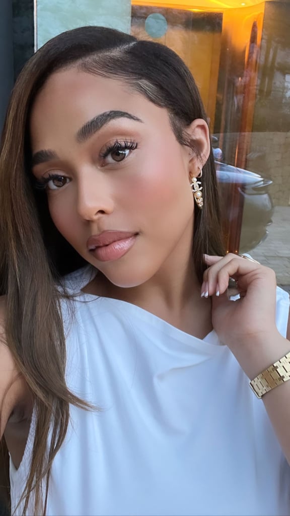 Jordyn Woods Wears White Hip-Cutout Dress on Vacation