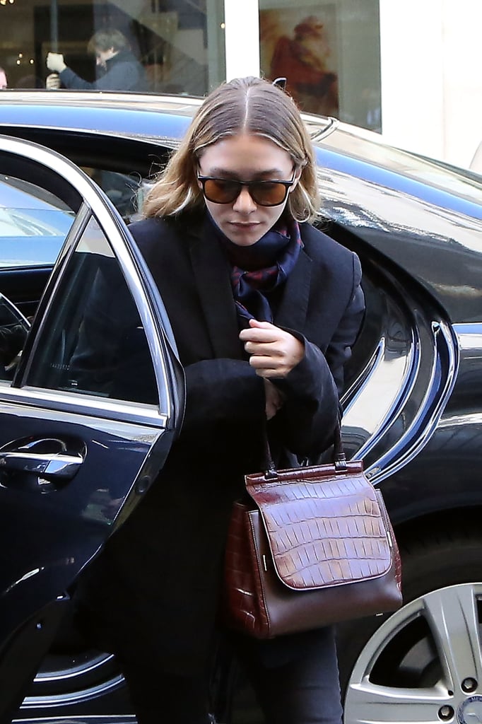 Ashley wore yellow tinted shades with an oxblood bag in Paris in 2014.