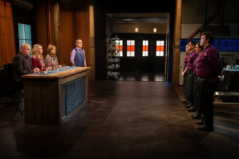 Host Ted Allen with judges Valerie Bertinelli, Chris Santos, and Amanda Freitag and contestants Aurora Wold, Ivan Marquez, Sandra Hakim, and Robert Gonzalez during round 1 tasting and judging during the Chocolate Part 4 of the Desserts Tournament, as seen