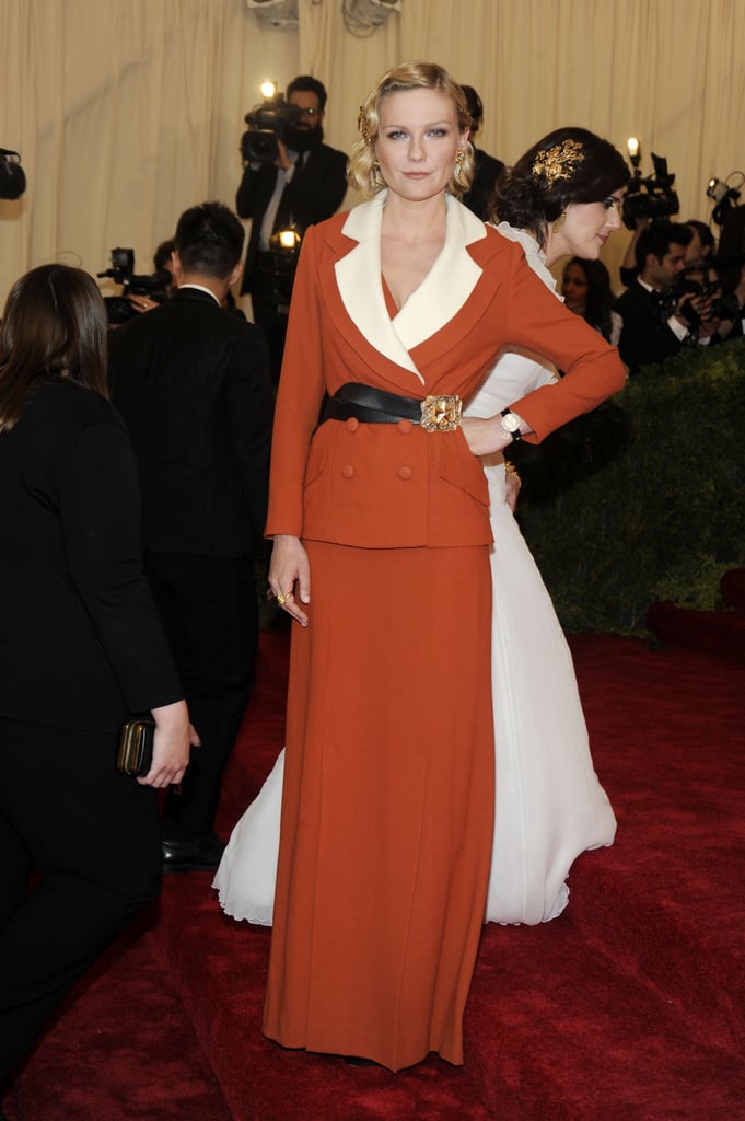 For the 2012 Met Gala, Kirsten showed up in an orange blazer and dress set from Rodarte.
