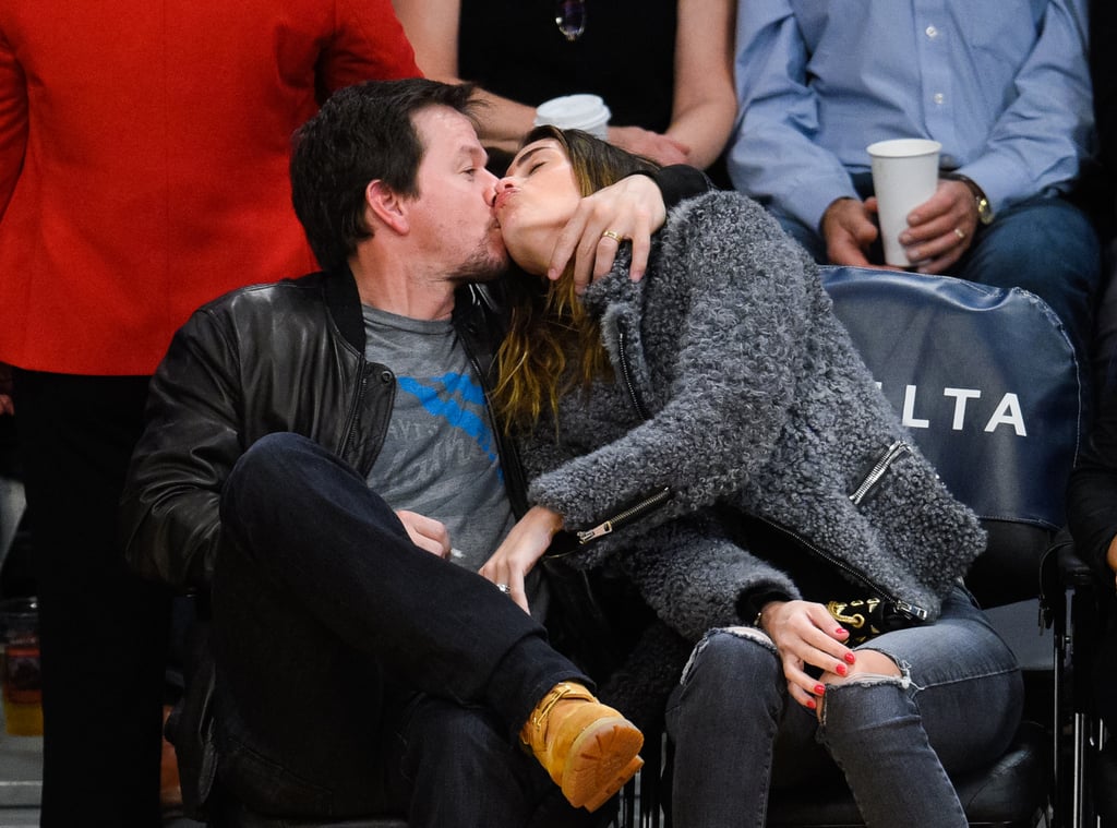 Mark Wahlberg and Rhea Durham shared a passionate kiss while sitting courtside at the LA Lakers vs. Milwaukee Bucks game in LA on Friday.