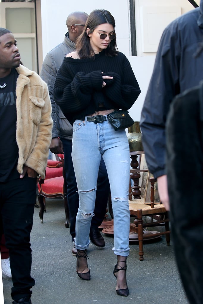 Kendall styled her Chanel waist bag with fishnet tights and an off-the-shoulder sweater in Paris.