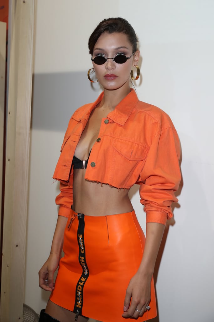 She wore the orange version of her Sami Miro piece with a flashy Heron Preston skirt at Men's Paris Fashion Week.