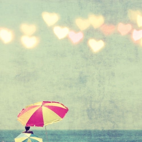 Heart-shaped bokeh details give this beach umbrella fine art photo ($30) a love-inspired twist.