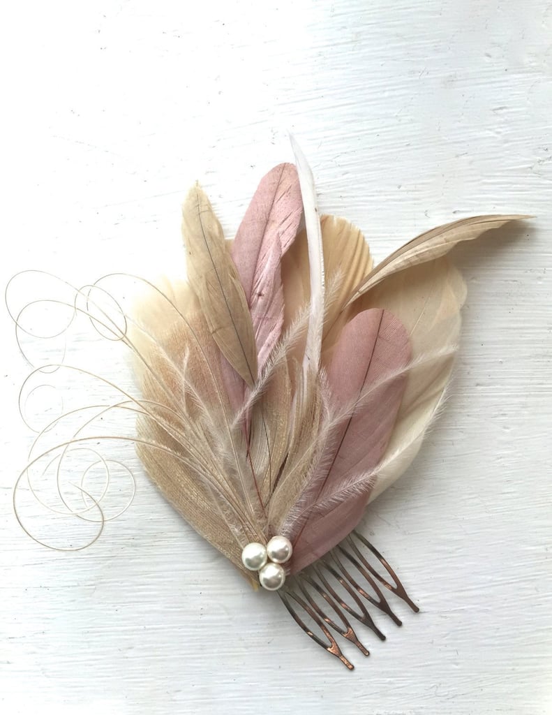 If you're looking for a subtle way to incorporate pearls into your bridal look, get this feather hair comb ($39).