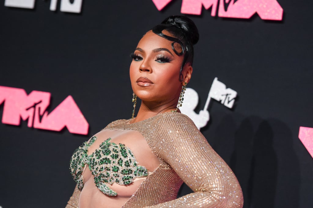 Ashanti's Clutch Features a Photo of Nelly at the VMAs