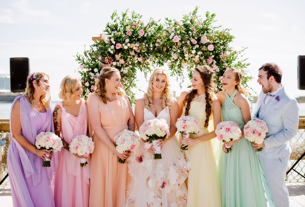 Colette had six bridesmaids — Ariel had six sisters! — whose dresses were handmade and designed by David McCarthy, and were inspired by the color palette of each sister from the movie.