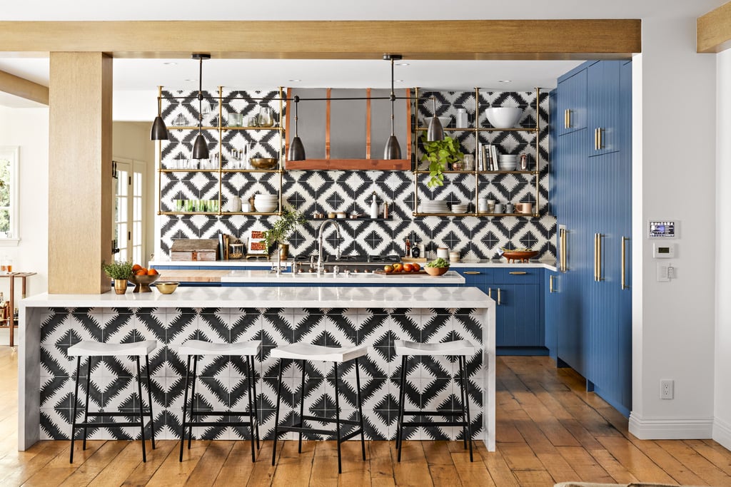 There's no denying it: this kitchen mixes bold colors and patterns seamlessly. This graphic geometric design is offset with the perfect touch of blue.