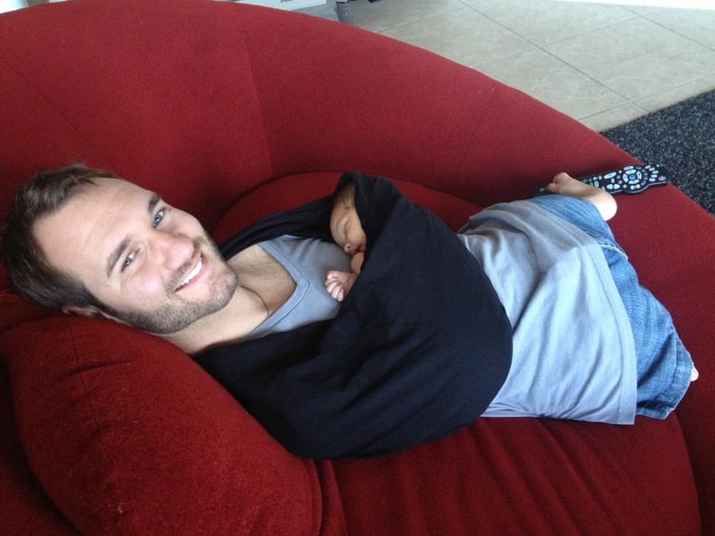 Motivational Speaker Nick Vujicic, Born Without Limbs, Holds His Child