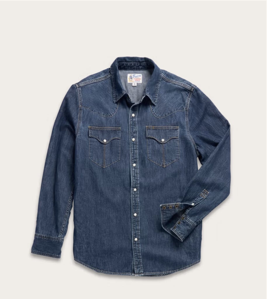 Tecovas Men's Denim Long Sleeve Pearl Snap ($95)
What makes this button-down stand out from other brands is in the details. The curved western stitching and the pearl snap buttons instantly elevate the 100 percent denim top. It can easily be styled with jeans for a denim-on-denim look or with a summer trouser for a more neutral outfit.