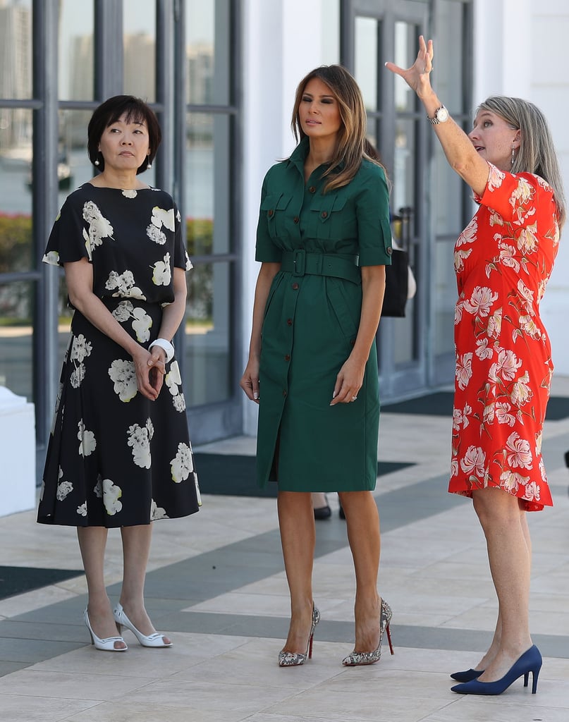 During a tour of the Flagler Museum in Palm Beach on April 18 with Akie Abe (wife of the Japanese Prime Minister Shinzō Abe), Melania wore a green utilitarian dress from Derek Lam and a pair of Christian Louboutin heels.