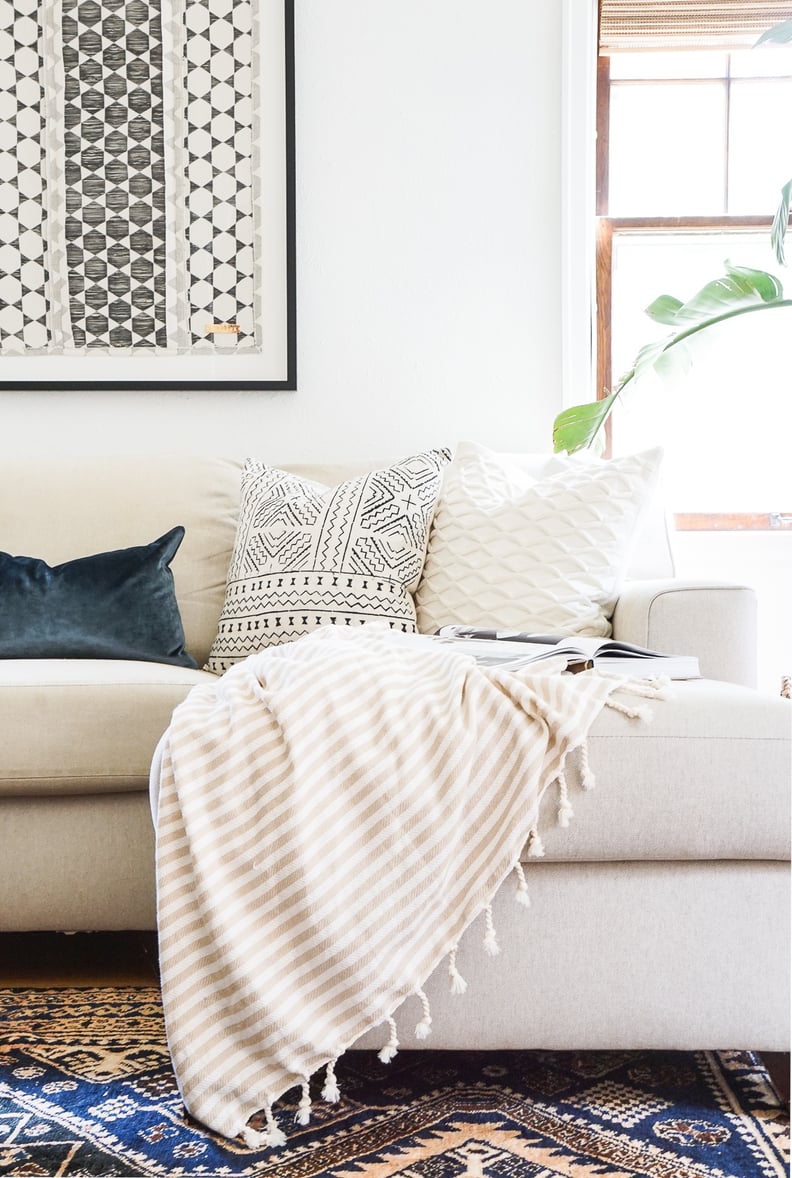 a cozy blanket, leaf pillow and fireplace for fall - Funky Junk Interiors