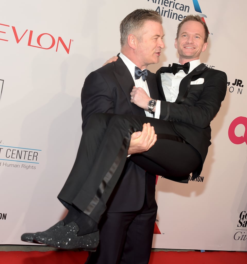 Alec Baldwin gave Neil Patrick Harris a serious lift on the red carpet at Elton John's annual AIDS Foundation Benefit in NYC on Tuesday.